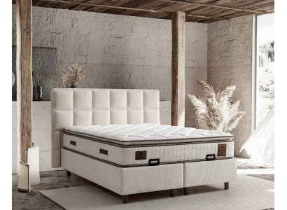 Elegantes Bett mit Matratze aus Textil in Beige