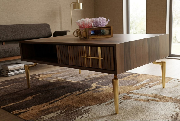 Stilvoller Couchtisch mit eleganten goldenen Beinen und Schublade