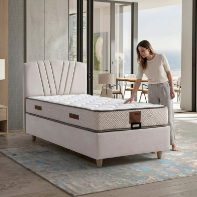 Elegantes Bett mit Matratze aus Textil in Beige