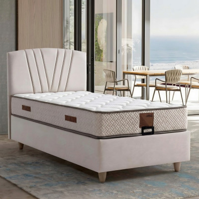 Elegantes Bett mit Matratze aus Textil in Beige