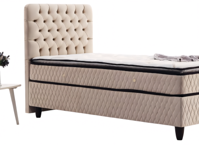 Beiges Polsterbett mit hoher Rückenlehne und klassischer Rautensteppung
